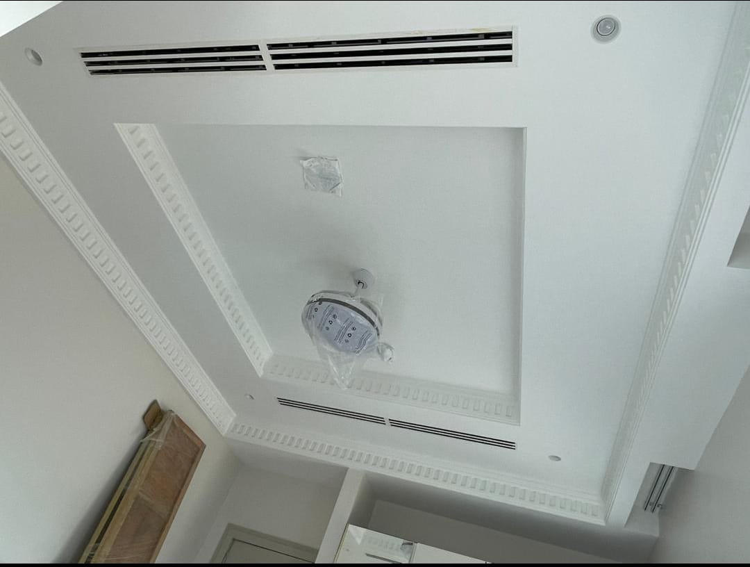 Minimalist linear slot diffusers integrated into premium residence drywall